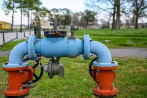 Red And Blue Water Pipe With Backflow Prevention