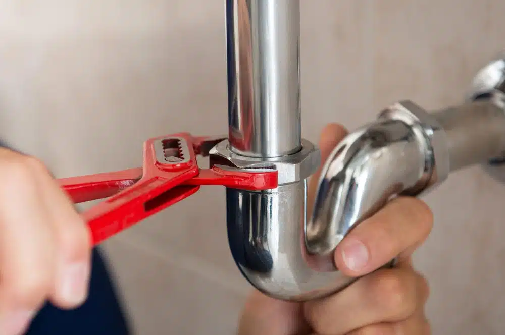 Plumber Fixing Sink Pipe Fittings